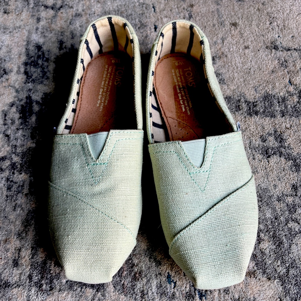 TOMS shoes in pale light green & never worn!